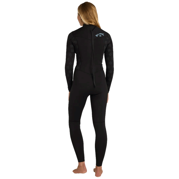 back view of woman wearing a black back zip wetsuit