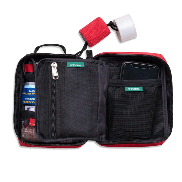opened survival kit bag showing multiple pockets