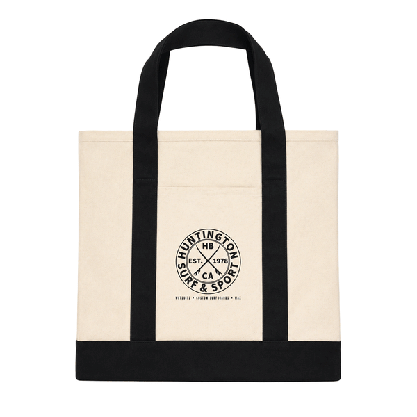 Huntington Surf & Sport natural canvas tote bag with black straps and logo. White background