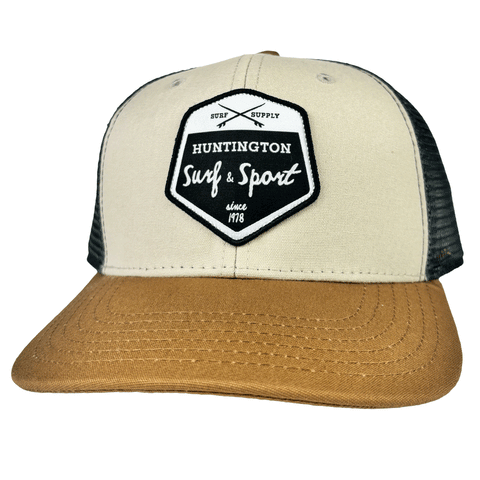 brown and tan trucker hat with black and white patch logo