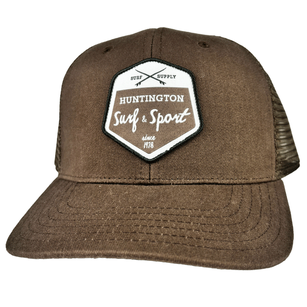 brown trucker hat with white and brown patch logo