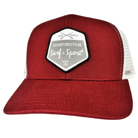 red and white trucker hat with white and grey patch logo