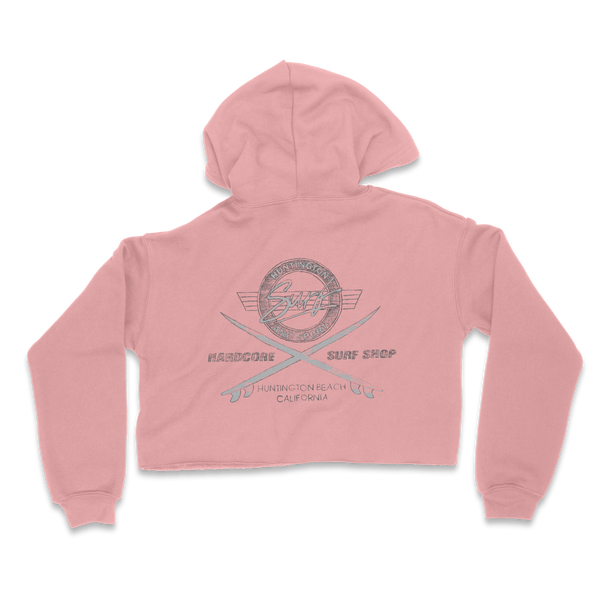Pink cropped hoodie with a graphic design on the back against a white background