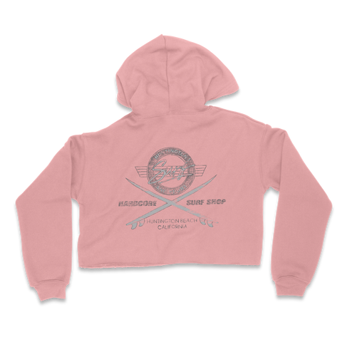 Pink cropped hoodie with a graphic design on the back against a white background