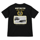 boys black t-shirt with image of the HB PIer and a wave. above image reads Huntington Surf and Sport. El Nino 2026. 