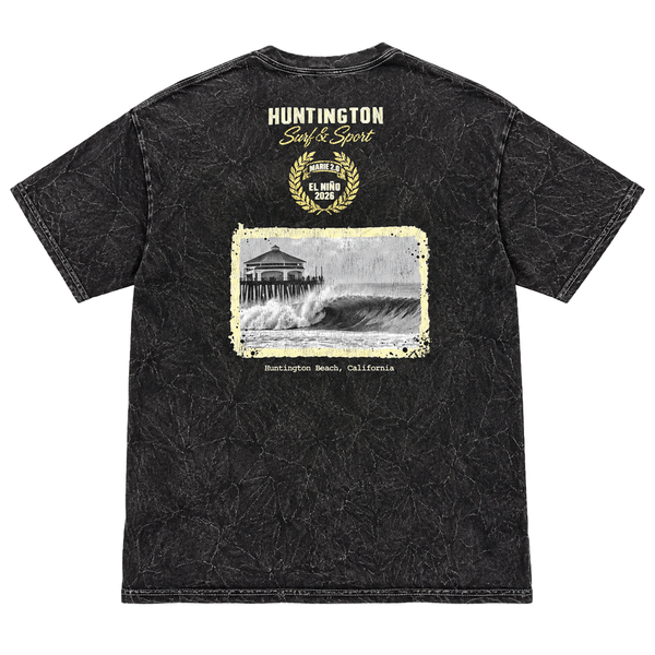 back of a washed black t-shirt with image of a wave with HB peir in background