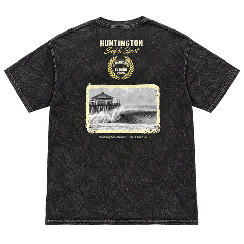back of a washed black t-shirt with image of a wave with HB peir in background