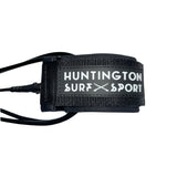 surfboard leash in black with HSS branding on cuff