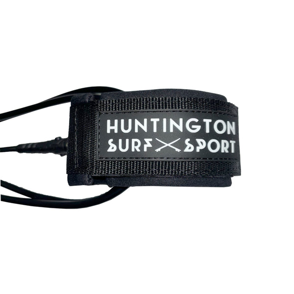 surfboard leash in black with HSS branding on cuff