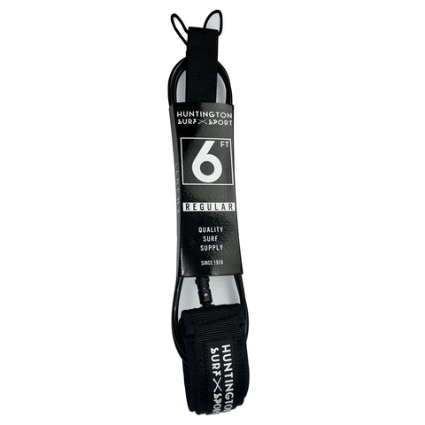 Black and white surf leash with 'Huntington Surf & Sport' branding on a white background