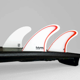 tail of surfboard with ethan ewing model fins on. 