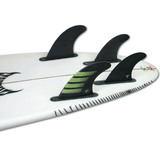 tail of white surfboard with 4 fins attached