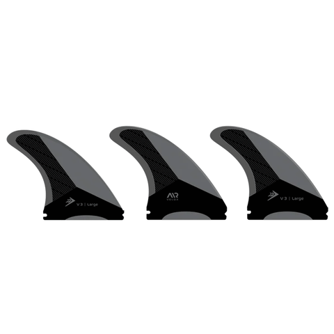 3 black and grey surf fins on a white background