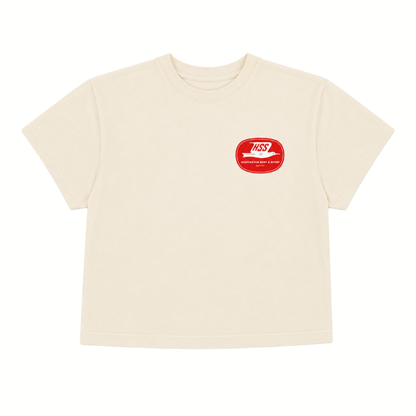 front of ivory colored shirt with small red logo on chest.