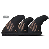 3 black surf fins with tan accents on a white background