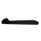 profile view of black traction pad with steep tail