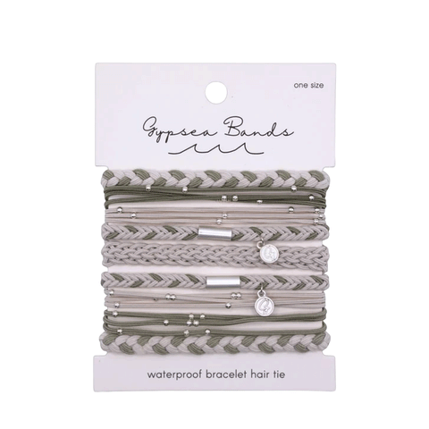 9 various Hair ties / bracelets that are all white and green colored