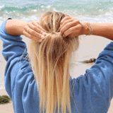 woman tying her hair