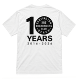 back of white t-shirt with black logo that reads 10 years 2016-2026. the 0 is the hb boardriders logo