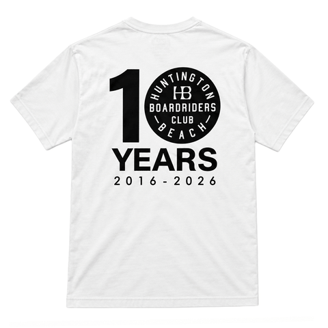 back of white t-shirt with black logo that reads 10 years 2016-2026. the 0 is the hb boardriders logo