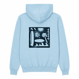 back of light blue hooded sweatshirt with silhouette of surfboards trees and waves