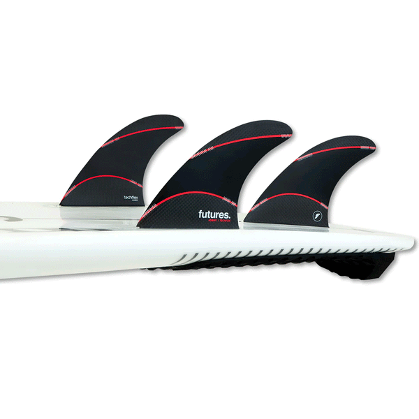 tail of surfboard with 3 surf fins attached