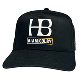 black hat with "HB #IAMKOLBY" in white written on the front