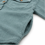 Close-up of soft textured fleece fabric with side pockets