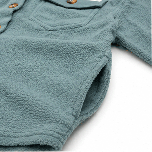 Close-up of soft textured fleece fabric with side pockets