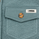 Detail of HSS logo patch and tortoiseshell buttons.