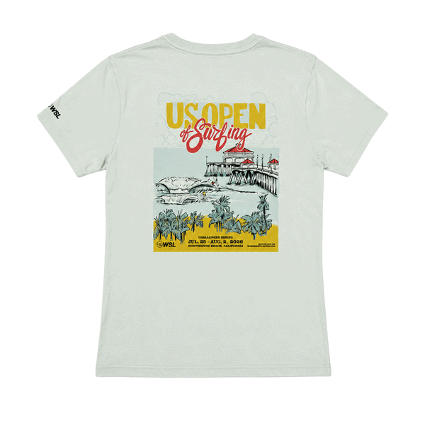 Women's light seafoam T-shirt shown from the back with a colorful 2026 US Open of Surfing Huntington Beach graphic featuring the pier, ocean waves, and palm trees.