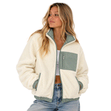 person wearing green and beige zip up fleece jacket