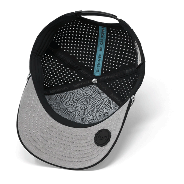 view of bottom of hat with grey bill and mesh backing