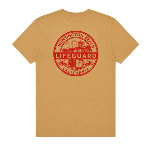 Back of tan Huntington Beach Lifeguard men's T-shirt with large red lifeguard emblem graphic.