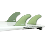 tail of surfboard with 3 surf fins attached