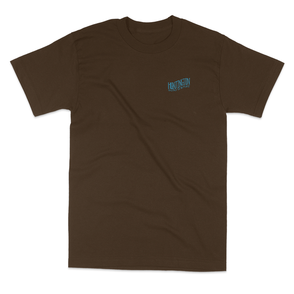 brown t shirt with blue logo on chest