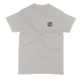 Gray t-shirt with a small logo on the chest against a white background