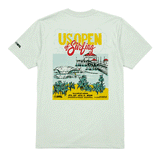 Back view of a light sage green men's T-shirt displayed on a clean white background. The shirt features a large, colorful "US Open of Surfing" graphic centered on the back, showcasing the Huntington Beach Pier, ocean waves, palm trees, and event branding in yellow, red, teal, and black. A small WSL logo is printed on the left sleeve. The design highlights the Huntington Beach, California surf event with a vibrant coastal illustration and retro-inspired typography.