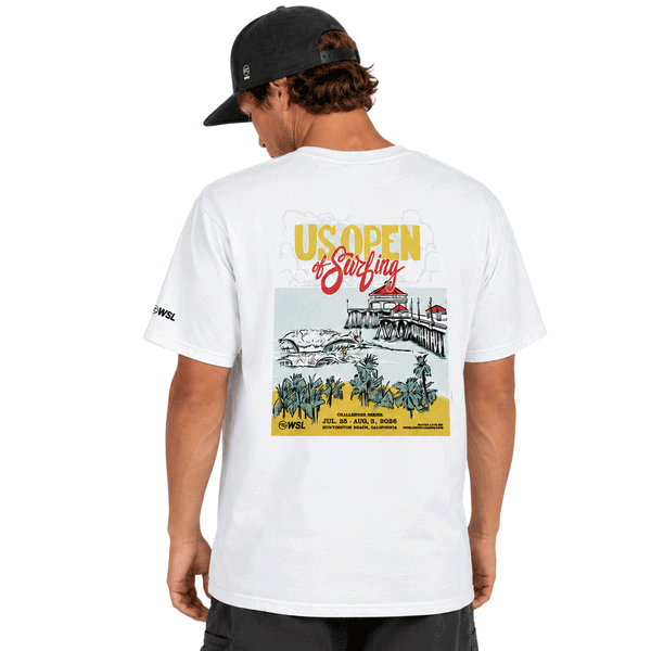 Back view of a  white men's T-shirt displayed on a clean white background. The shirt features a large, colorful "US Open of Surfing" graphic centered on the back, showcasing the Huntington Beach Pier, ocean waves, palm trees, and event branding in yellow, red, teal, and black. A small WSL logo is printed on the left sleeve. The design highlights the Huntington Beach, California surf event with a vibrant coastal illustration and retro-inspired typography.