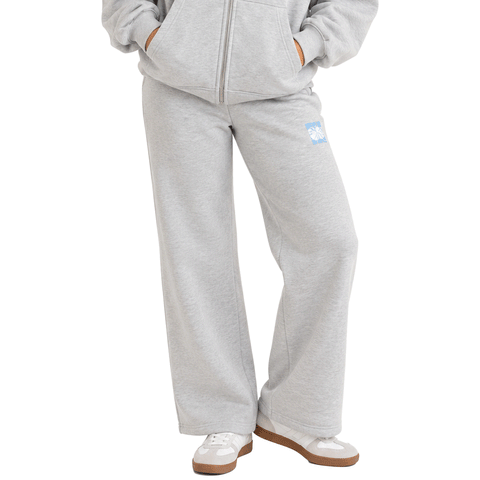 person weaing grey sweatpants with wide leg openings
