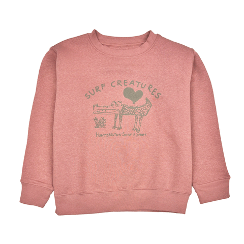 pink crew neck sweatshirt with cartoon drawing of a crocodile with text " Surf Creatures"