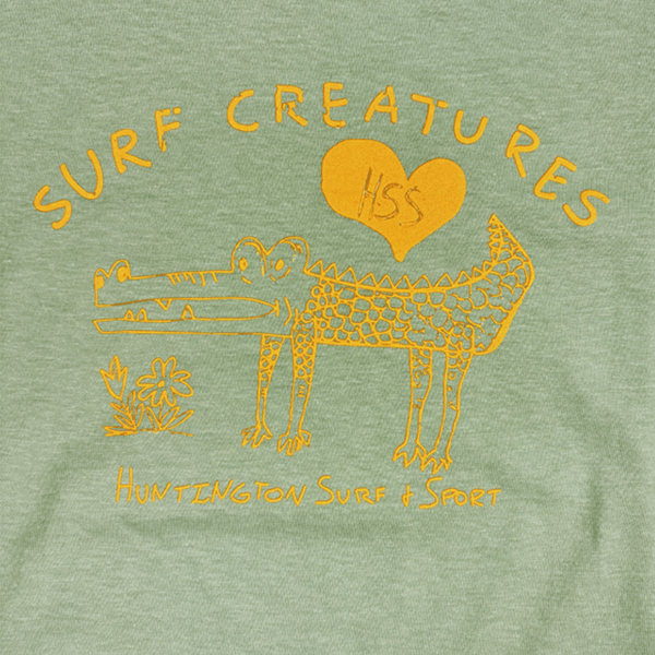 drawing of a cute crocodile with text "surf creatures"