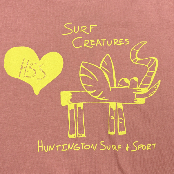 yellow print of heart and animal on pink fabric