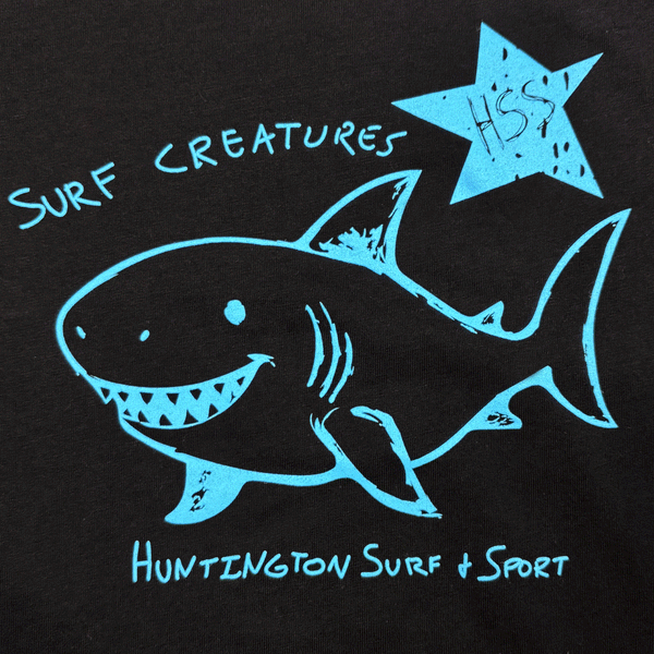 blue print of "surf creatures" and a shark smiling