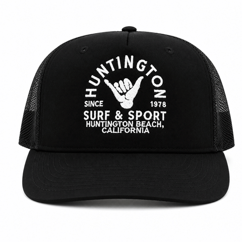 black trucker hat with white embroidered logo on a white background