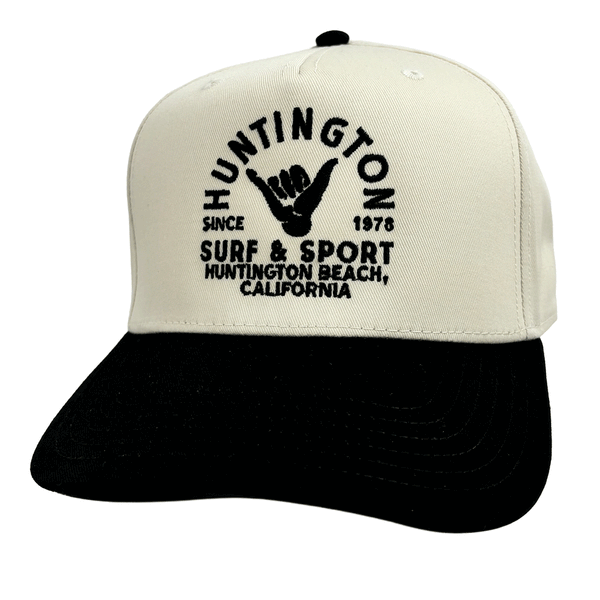 white & black hat with black embroidered logo on white background