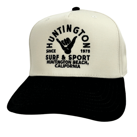 white & black hat with black embroidered logo on white background