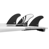 tail of surfboard with 3 fins attached