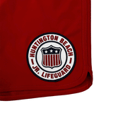 red boardshorts with HB Jr lifeguards logo on white background