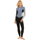 front view of woman wearing a blue, grey and black back zip wetsuit